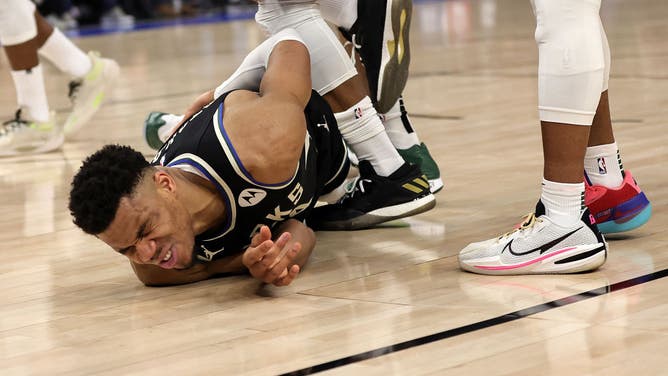 Bucks' Giannis Antetokounmpo injures his back after a nasty spill during Game 1 of the Eastern Conference First Round Playoffs vs. the Heat at Fiserv Forum in Milwaukee, Wisconsin.