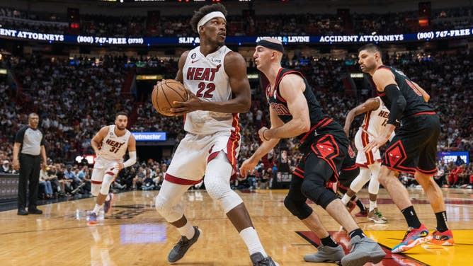Chicago Bulls G Alex Caruso defends Heat wing Jimmy Butler at Kaseya Center in Miami.