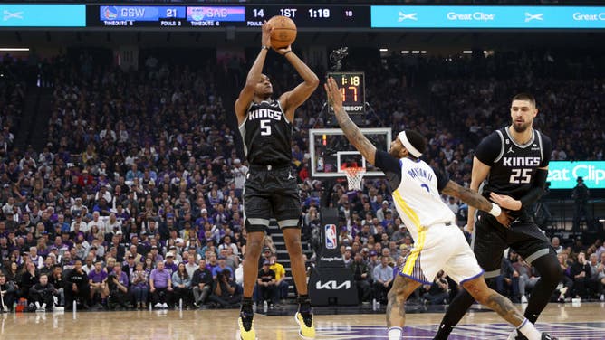Warriors G Gary Payton II contests a Kings' De'Aaron Fox 3-pointer during Game 2 of the Western Conference First Round Playoffs at Golden 1 Center.
