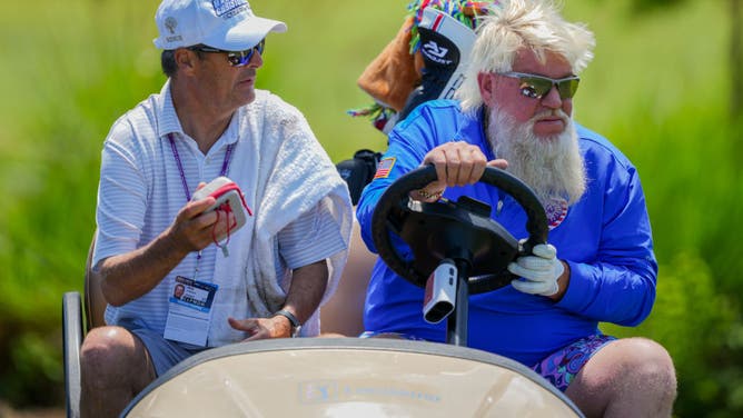 John Daly of the United States, who is the only player authorized to use a cart, gets the cart going after his drive from the 1st tee during the Warm-up Round of the Zurich Classic of New Orleans at TPC Louisiana.