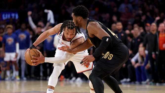 Knicks PG Jalen Brunson tries to keep the ball from Cavaliers' Donovan Mitchell during Game 4 of the Eastern Conference 1st-Round Playoffs at Madison Square Garden.