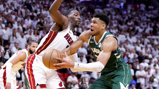 Giannis Antetokounmpo drives the paint against Heat big Bam Adebayo in Game 4 of the 2023 NBA Eastern Conference 1st Round Playoffs at Kaseya Center in Miami.