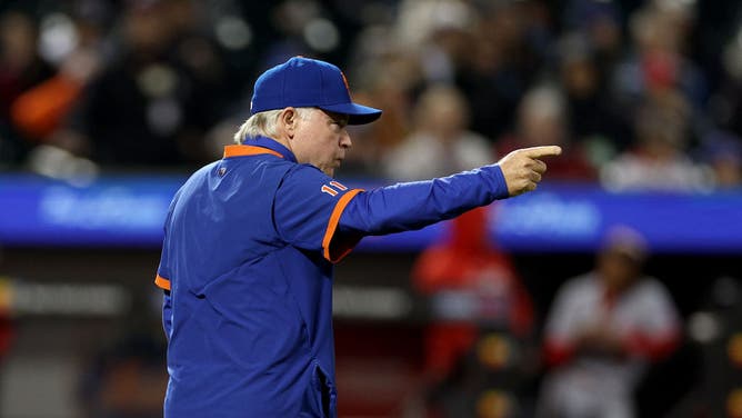 Mets manager Buck Showalter makes a call to the bullpen in the 7th inning vs. the Washington Nationals at Citi Field.
