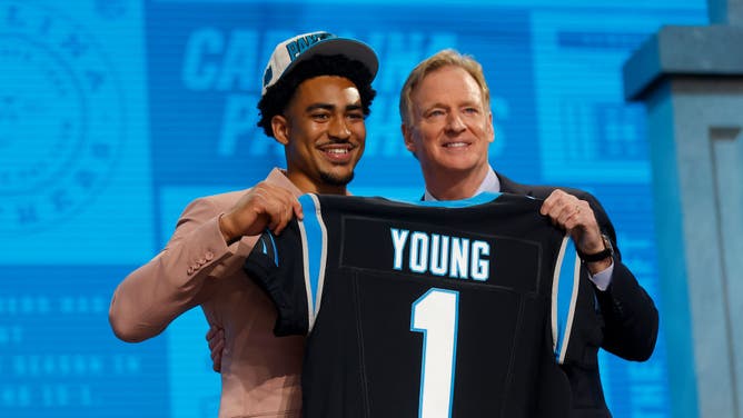 Bryce Young poses with NFL Commissioner Roger Goodell after being selected 1st overall by the Carolina Panthers in the 2023 NFL Draft at Union Station in Kansas City, Missouri.