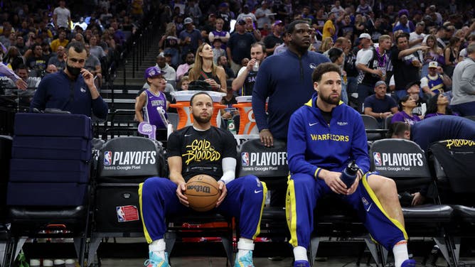Stephen Curry and Klay Thompson sit on the bench before Game 5 of the NBA Western Conference First Round Playoffs vs. the Kings at Golden 1 Center in Sacramento, California.