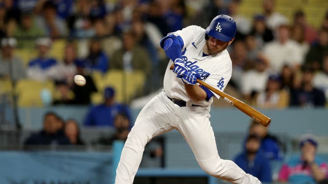Dodgers 3B Max Muncy hits an RBI double vs. the St. Louis Cardinals at Dodger Stadium.