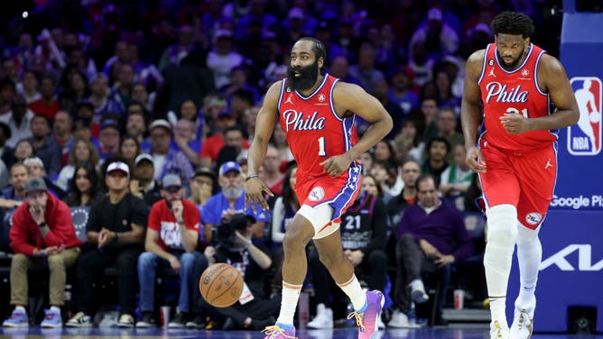 76ers PG James Harden dribbles up the floor with Joel Embiid following against the Celtics at home Friday.