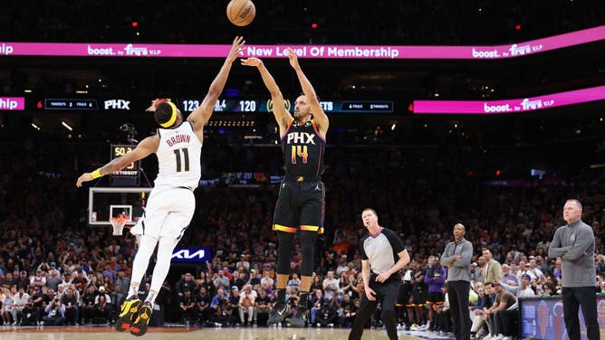 Suns SG Landry Shamet puts up a 3-pointer shot over Nuggets SF Bruce Brown in Game 4 of the NBA Western Conference Semifinals at Footprint Center in Phoenix.