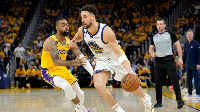 Warriors SG Klay Thompson drives past Lakers PG D'Angelo Russell during the 4th quarter in Game 5 of the Western Conference Semifinal Playoffs.