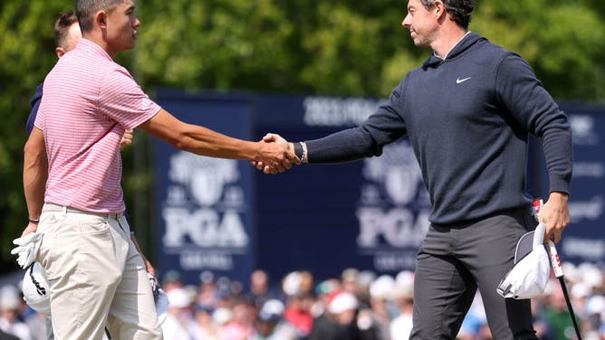 Collin Morikawa and Rory McIlroy shake hands on the 9th green during the 1st round of the 2023 PGA Championship at Oak Hill Country Club.
