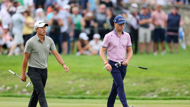 Collin Morikawa and Justin Thomas walk the 1st hole during the 2nd round of the 2023 PGA Championship at Oak Hill Country Club in Rochester, New York.