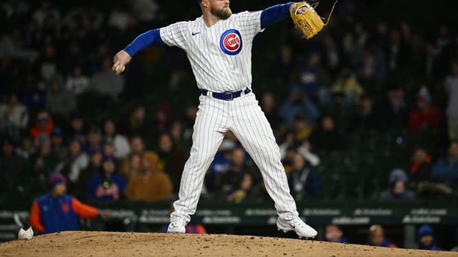 Tucker Barnhart of the Chicago Cubs pitches against the New York Mets in an MLB game at Wrigley Field.