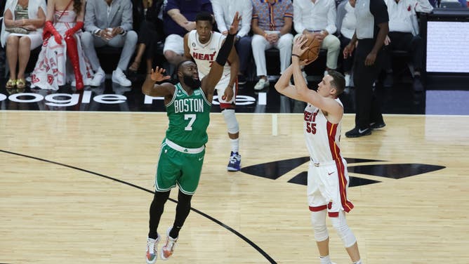 Heat SG Duncan Robinson shoots a 3 over Boston Celtics SG Jaylen Brown during Game 6 of the Eastern Conference Finals at Kaseya Center in Miami.