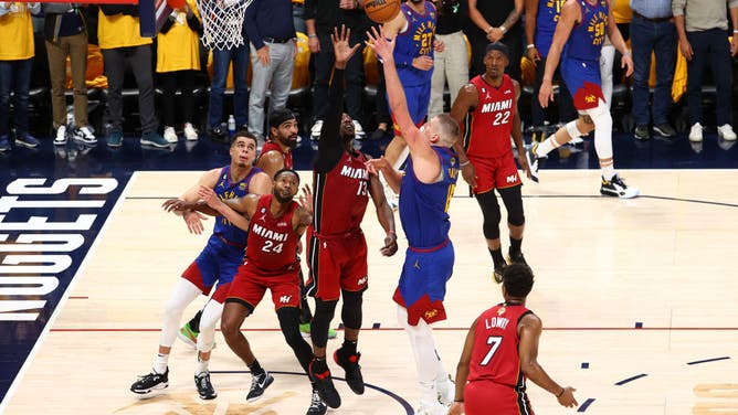 Nuggets C Nikola Jokic shoots over Miami Heat C Bam Adebayo in Game 1 of the 2023 NBA Finals at Ball Arena in Denver, Colorado.