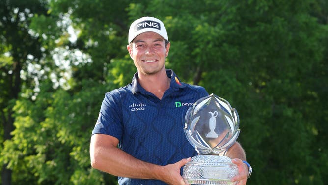 Viktor Hovland of Norway poses with the trophy after winning the Memorial Tournament presented by Workday in a playoff over Denny McCarthy of the United States at Muirfield Village Golf Club.