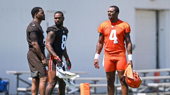 Deshaun Watson of the Cleveland Browns talks with Amari Cooper and Elijah Moore during the Cleveland Browns OTAs.
