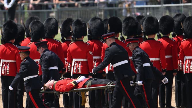 A British soldier passed out while playing the trombone in a military parade, but tried to get up and keep on tromboning.