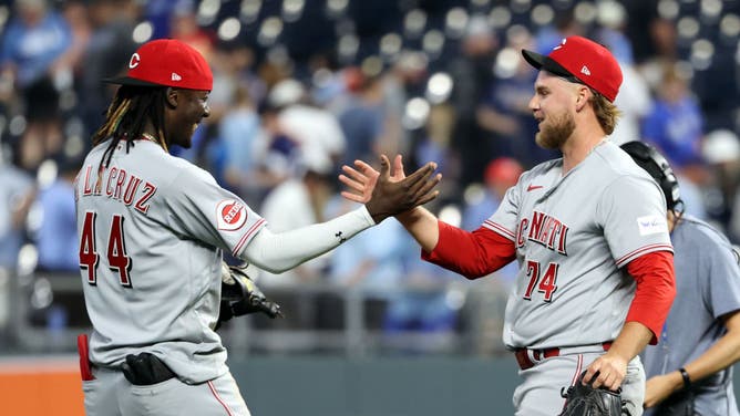Pitcher Ricky Karcher of the Cincinnati Reds is congratulated by Elly De La Cruz after defeating the Kansas City Royals in the bottom of the 10th inning in his MLB debut during the game at Kauffman Stadium on June 12, 2023 in Kansas City, Missouri.