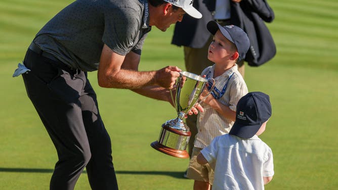 Keegan Bradley and sons Logan and Cooper after winning the Travelers Championship at TPC River Highlands in Cromwell, Connecticut.
