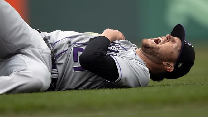 Kyle Freeland of the Colorado Rockies reacts after suffering an injury diving for a ball bunted by Brett Wisely of the San Francisco Giants during the seventh inning at Oracle Park on July 9, 2023 in San Francisco, California.