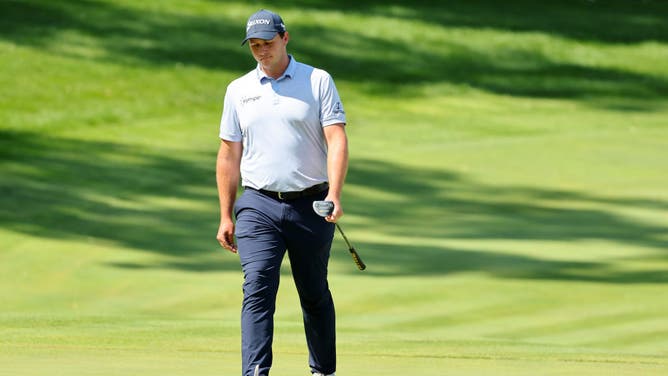 Sepp Straka dejectedly walks to the 18th green during the final round of the John Deere Classic at TPC Deere Run after hitting a shot into the water.