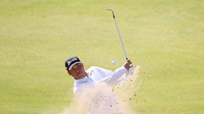 Matsuyama plays a bunker shot on the 18th hole during a practice round prior to The 151st Open at Royal Liverpool Golf Club in Hoylake, England.