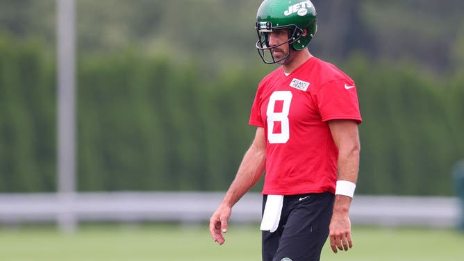 Aaron Rodgers of the New York Jets run drills during training camp at Atlantic Health Jets Training Center.