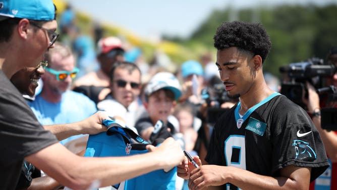 Bryce Young of the Carolina Panthers signs autographs for fans following Carolina Panthers Training Camp at Wofford College on July 26, 2023 in Spartanburg, South Carolina.