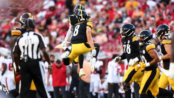 Kenny Pickett of the Pittsburgh Steelers celebrates with George Pickens after a touchdown during an NFL preseason game against the Tampa Bay Buccaneers at Raymond James Stadium on August 11, 2023 in Tampa, Florida.