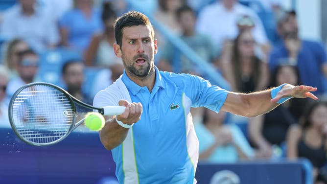 Novak Djokovic returns the ball during the men's singles final against Carlos Alcaraz at the Western & Southern Open.