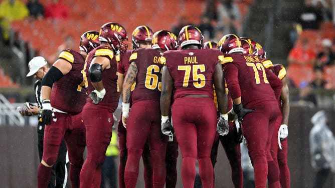 The Washington Commanders offense huddles during the first half of a preseason game against the Cleveland Browns at Cleveland Browns Stadium on August 11, 2023 in Cleveland, Ohio.