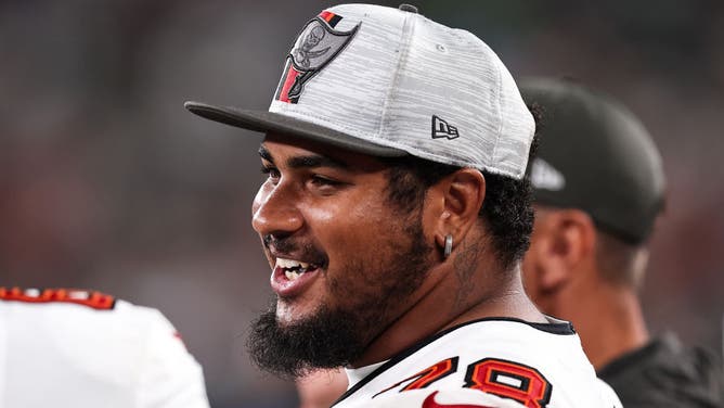 Tristan Wirfs of the Tampa Bay Buccaneers looks on from the sideline during the second quarter of the preseason game against the New York Jets at MetLife Stadium.