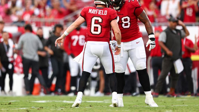 Bucs QB Baker Mayfield celebrates with LT Tristan Wirfs after throwing a TD against the Ravens at Raymond James Stadium.