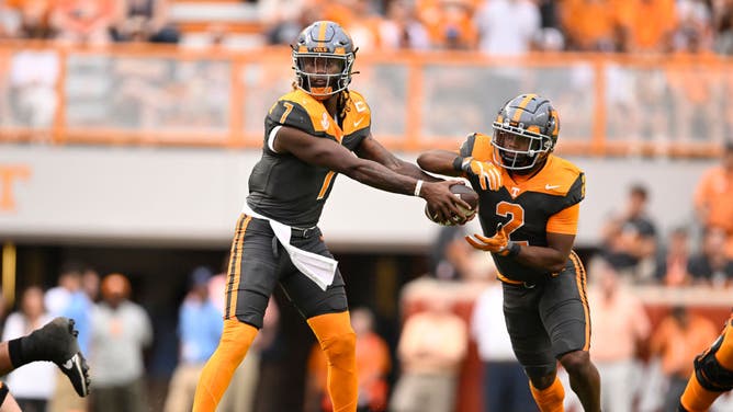Volunteers QB Joe Milton fakes a handoff to RB Jabari Small vs. the Austin Peay Governors at Neyland Stadium in Knoxville, Tennessee.
