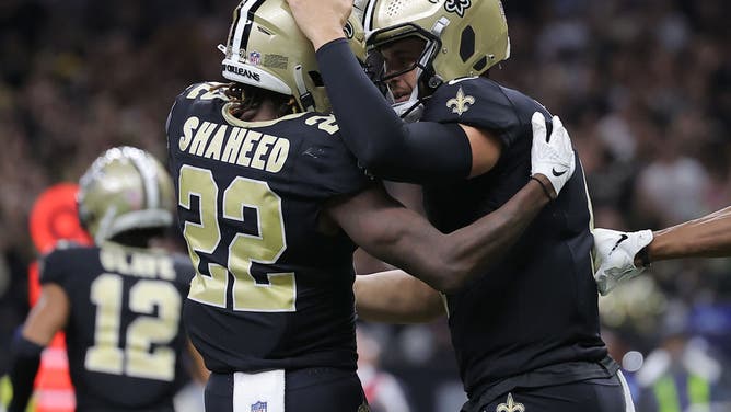 Rashid Shaheed of the New Orleans Saints celebrates with Derek Carr after Shaheed's touchdown reception during the third quarter against the Tennessee Titans at Caesars Superdome on September 10, 2023 in New Orleans, Louisiana.
