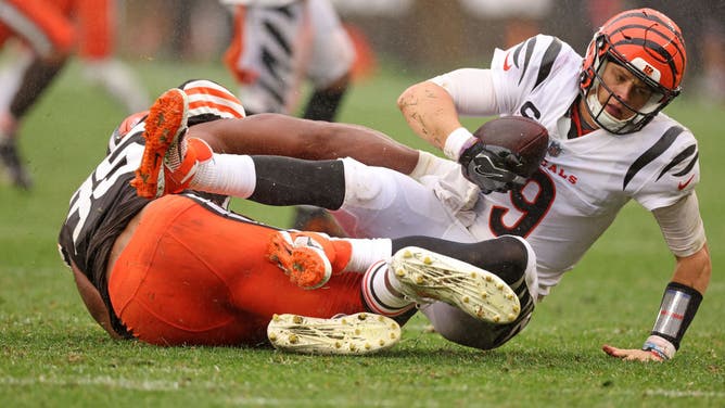 Joe Burrow #9 of the Cincinnati Bengals is sacked by Myles Garrett #95 of the Cleveland Browns during the second half at Cleveland Browns Stadium on September 10, 2023 in Cleveland, Ohio.