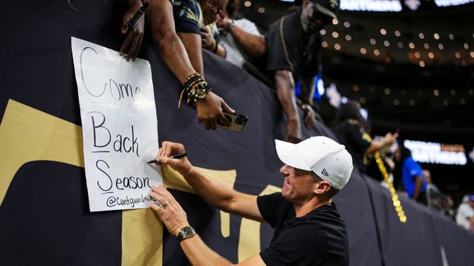 Former NFL player Drew Brees interacts with New Orleans Saints fans.