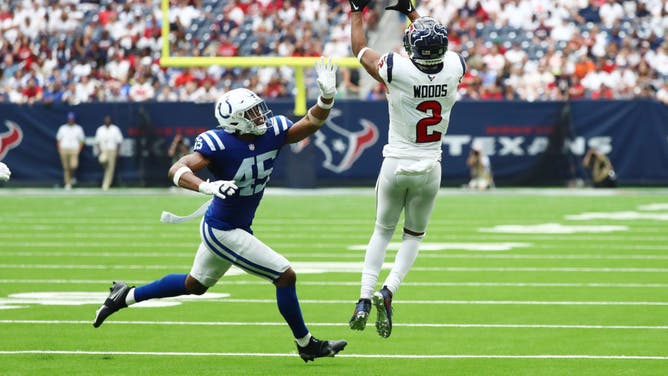 Texans WR Robert Woods catches the ball with Indianapolis Colts LB E.J. Speed at NRG Stadium in Houston, Texas.