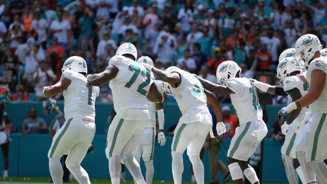Miami Dolphins quarterback Tua Tagovailoa leads a dance line to celebrates a touchdown in the first half during the game between the Denver Broncos and the Miami Dolphins on Sunday, September 24, 2023 at Hard Rock Stadium, Miami, Fla.
