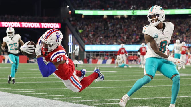 New England Patriots WR Kendrick Bourne attempts a diving catch vs. the Miami Dolphins at Gillette Stadium in Foxborough, Massachusetts.