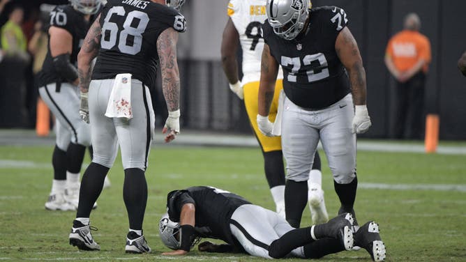 Jimmy Garoppolo of the Las Vegas Raiders is slow to get up after being injured against the Pittsburgh Steelers.