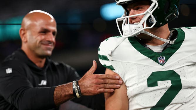 Head coach Robert Saleh of the New York Jets interacts with quarterback Zach Wilson.