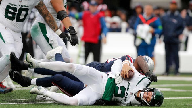 New England Patriots LB Anfernee Jennings sacks New York Jets QB Zach Wilson at MetLife Stadium.