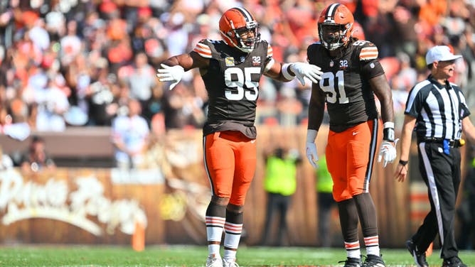 Browns EDGE Myles Garrett and DE Alex Wright celebrate after a sack vs. the Baltimore Ravens at Cleveland Browns Stadium in Ohio.