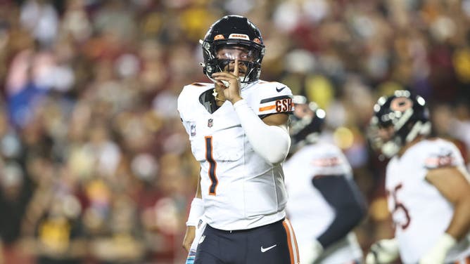 Chicago Bears QB Justin Fields celebrates after passing to Bears WR DJ Moore for a TD vs. the Washington Commanders at FedExField in Landover, Maryland.