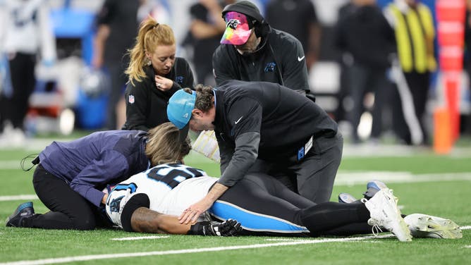 Medical personnel attend to Chandler Zavala of the Carolina Panthers after he was injured in the first quarter against the Detroit Lions at Ford Field.