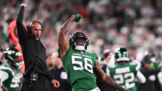 New York Jets LB Quincy Williams and coach Robert Saleh react after a defensive stop vs. the Philadelphia Eagles at MetLife Stadium in East Rutherford, New Jersey.