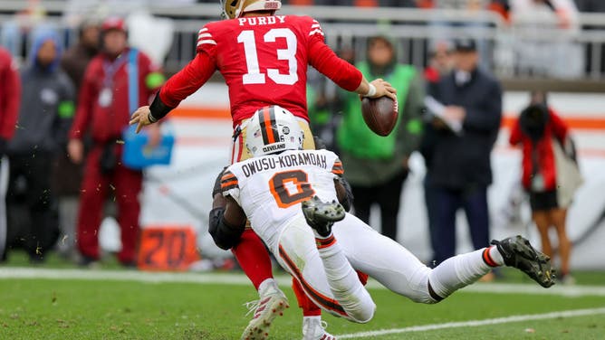 Browns LB Jeremiah Owusu-Koramoah tackles 49ers QB Brock Purdy at Cleveland Browns Stadium in Ohio.