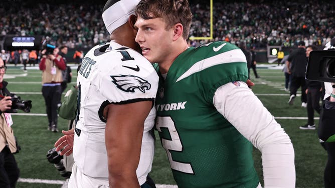 Jalen Hurts of the Philadelphia Eagles and Zach Wilson of the New York Jets embrace after the game at MetLife Stadium on October 15, 2023 in East Rutherford, New Jersey.