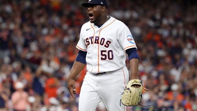 Astros reliever Hector Neris reacts after the final out of the 8th inning vs. the Texas Rangers during Game 1 of the 2023 ALCS at Minute Maid Park in Houston.
